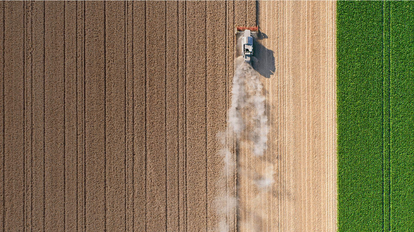 Aerial view of a combine harvester working a field